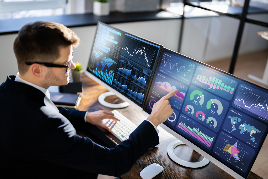 Office scene with digital marketers using Google Search Console and analytics dashboards to track SEO performance after an algorithm update.